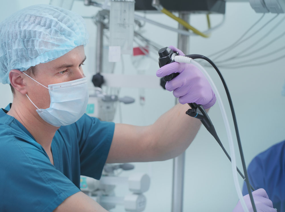 Doctor working with endoscopy equipment