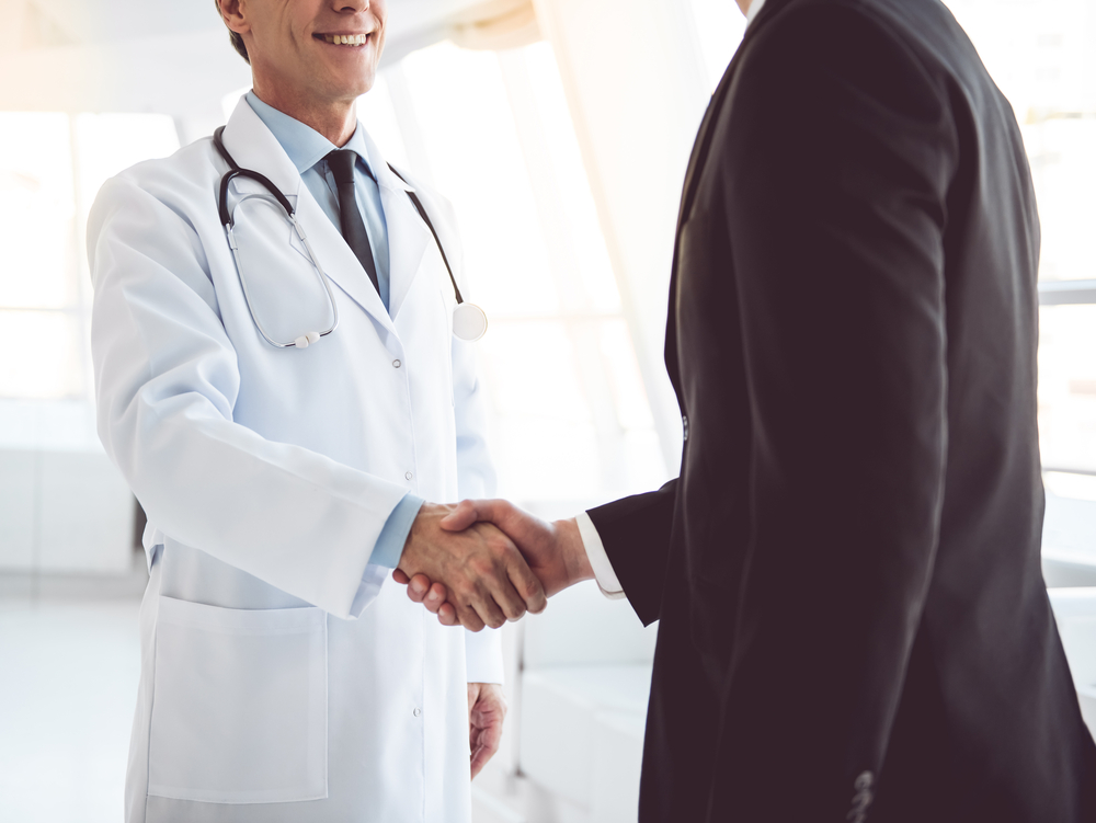 Doctor Shaking Mans Hand 